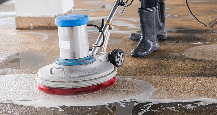 Cleaning professional maintaining the floor